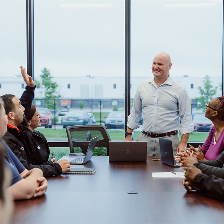 MMI Staff in a Meeting, Creating Connections and Sharing Experiences